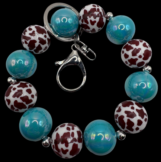 Teal Cow Print Wristlet