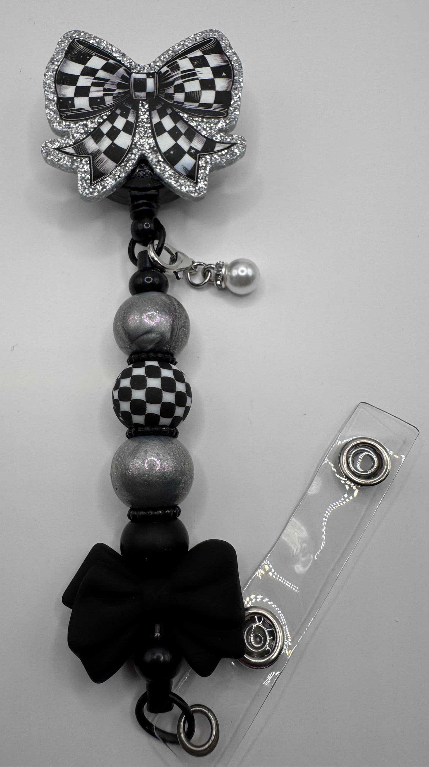 Checkered Bow Badge Reel